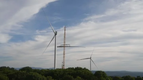 Wind Turbine Construction Timelapse - Crane Lifting Rotor Blade and Propeller As Stock Footage 330497182