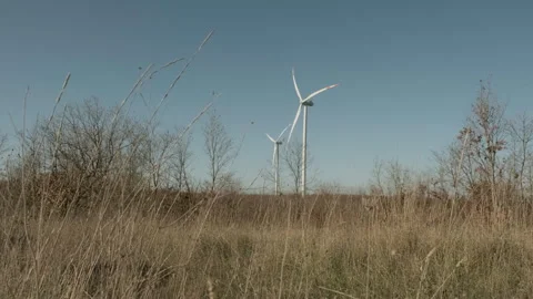 Wind Turbine in a Dry Grass Field | Stock Video | Pond5
