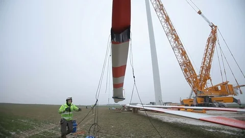 Wind Turbine Element Lifted by a Crane. Time-lapse Stock Footage 72368714