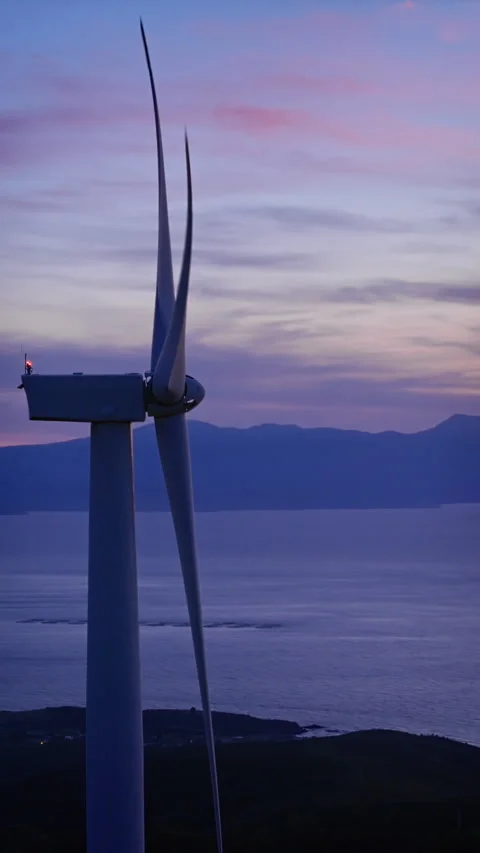 Wind turbine energy generator zero emission Carbone on sunset sky Stock Footage 337373416