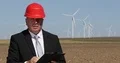 Wind Turbine Engineer Presenting Future Alternative Energy Electrical Power 4k or 4k+ Resolution