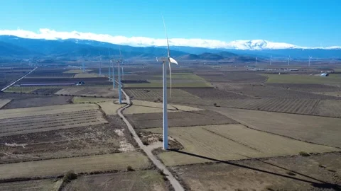 Wind turbine farm generating clean renewable energy Stock Footage 327550125
