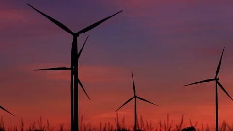 Wind turbine farm with rays of light at sunset Stock Footage 119193105