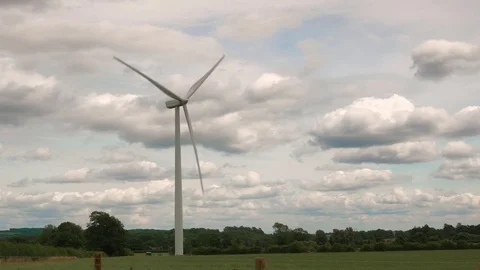 Wind turbine in field against cloudy sky August 2017 Video stock 83728092