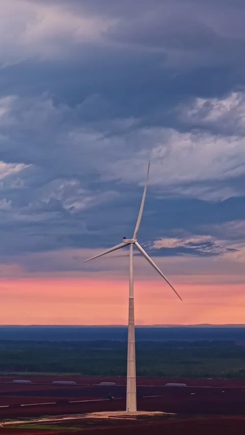 Wind Turbine in Field - Cloudy Sunset Stock Footage 344423107