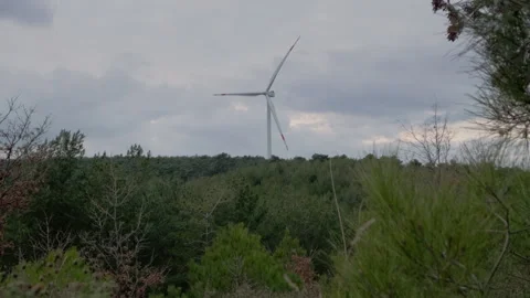 Wind Turbine in a Forested Landscape Stock Footage 282927354
