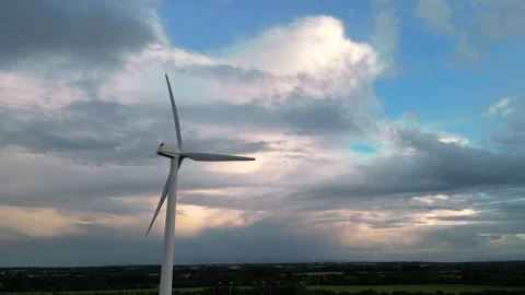 Wind turbine generating electricity in fields in ireland Stock Footage 246433737
