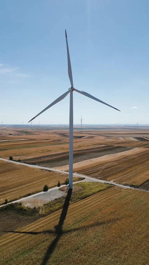 Wind turbine generating electricity in a rural field Stock Footage 344601779