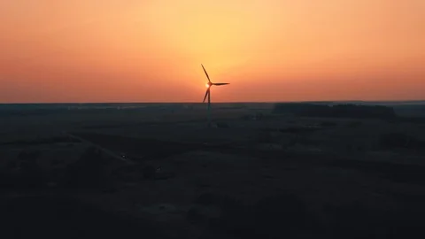 Wind turbine generator at sunset, aerial view. Windmill energy generator Stock Footage 127282927
