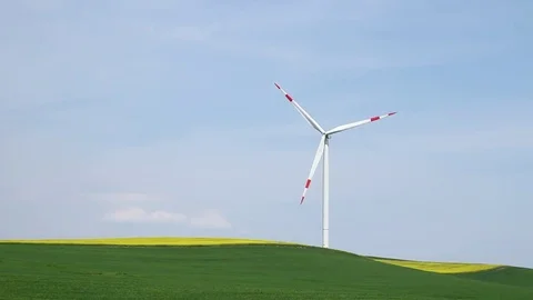 Wind turbine on green grass Stock Footage 74591436