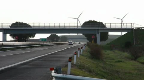 Wind turbine on highway Stock Footage 10590175