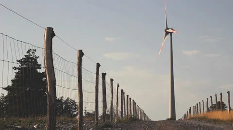 Wind turbine on a hill Stock Footage 26354396