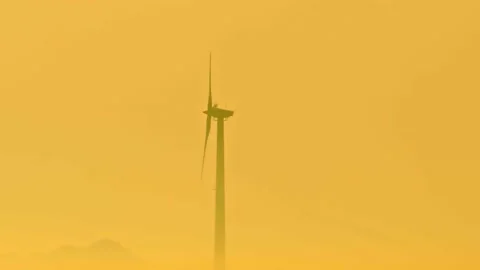 Wind turbine on a hot summers evening Stock Footage 140434026