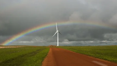 Wind turbine idling with rainbow in background. Stock Footage 87881363