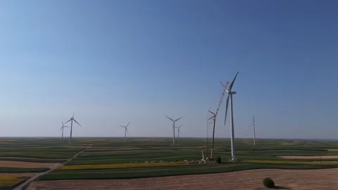 Wind turbine installation using a large construction crane. The assembly process Stock Footage 312734250