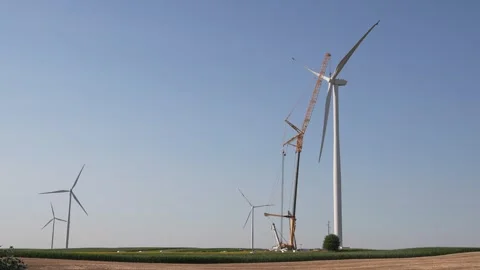 Wind turbine installation using a large construction crane. The assembly process Stock Footage 312736552