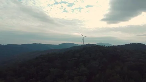Wind Turbine on a Misty Hilltop Stock Footage 282927128