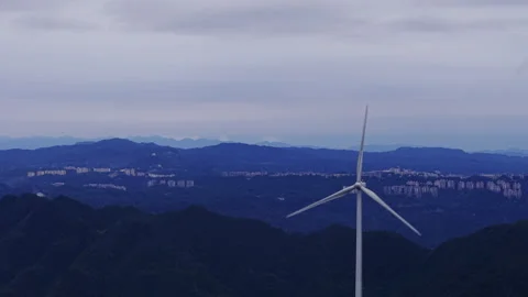 Wind Turbine Misty Mountains Cinematic Twilight Orbit 4K HLG Stock Footage 345622425