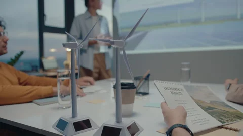 Wind Turbine Models on Table during Meeting of Sustainable Energy Engineers Stock Footage 242037893
