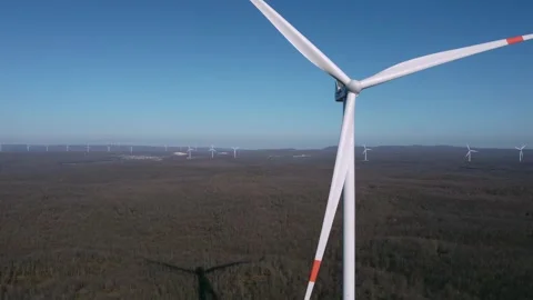 Wind Turbine in Motion Over Forest Landscape Stock Footage 282925203