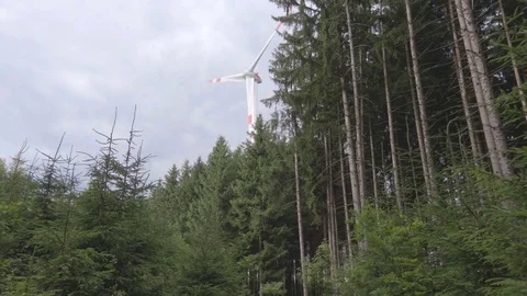 Wind turbine in motion view from far away Stock Footage 77548347