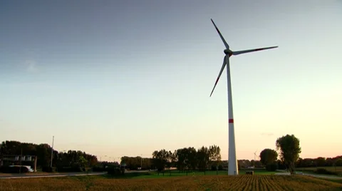 Wind Turbine next to a highway 動画素材 8666529