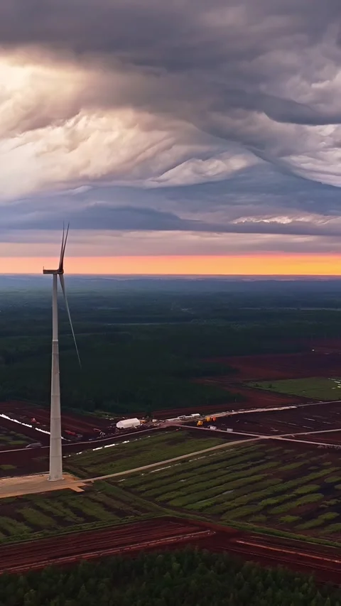 Wind Turbine in Open Field at Sunset - Cloudy Sky Stock Footage 342978002