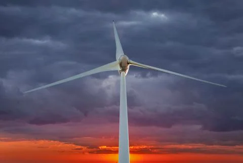Wind Turbine over clouds Stock Photos
