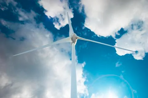 Wind Turbine over clouds Stock Photos
