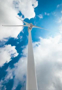 Wind Turbine over clouds Stock Photos