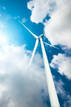 Wind Turbine over clouds Stock Photos