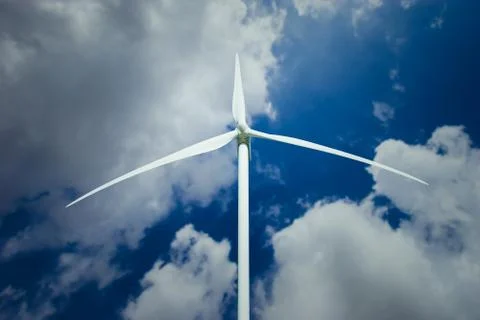 Wind Turbine over clouds Stock Photos