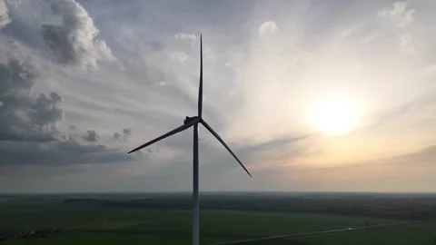Wind Turbine Over Forest at Sunset Stock Footage 308954886