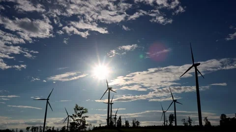 A wind turbine park in an evening time lapse 4k 30fps video Stock-Footage 282013837