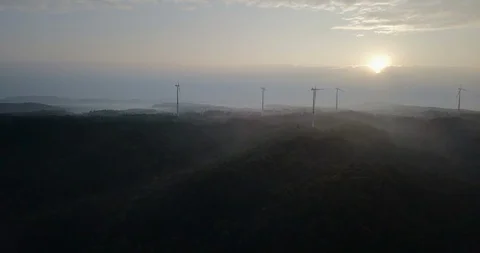 Wind turbine park with multiple wind turbines at sun rise aerial perspective Stock Footage 119820461