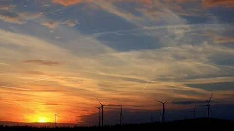 A wind turbine park sundown 4k timelapse Stock Footage 344635048