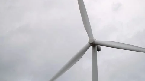 A wind turbine is a power generating station. Windmill on the field. Slow-motion Stock Footage 172100093