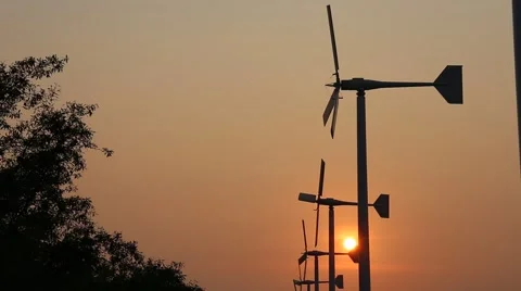 Wind turbine power generator at twilight in Bang Pu Recreational Retreat Center Stock Footage 64006268