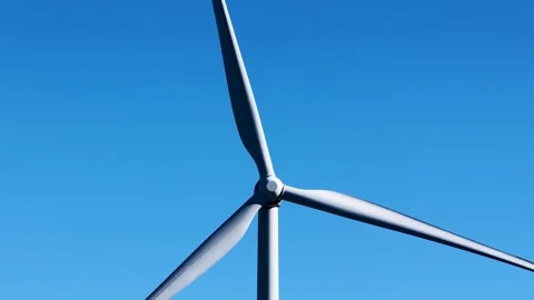 Wind Turbine Propeller Rotating Against Clear Blue Sky in Australia Stock Footage 341835704