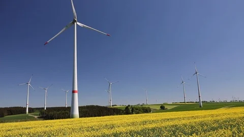 Wind turbine in rapeseed Stock Footage 98995875