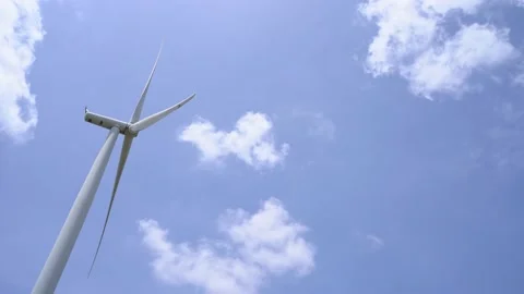 Wind turbine renewable energy source summer with blue sky Stock Footage 154572974