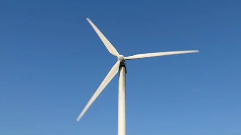Wind turbine rotates generating clean renewable energy in Cilento Video stock 255727606