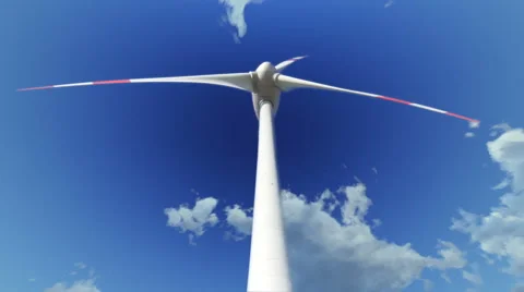 Wind turbine rotates under cloudy sky Stock Footage 41299217