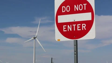 Wind Turbine Rotating in Background of Do Not Enter Sign Stock Footage 54801371