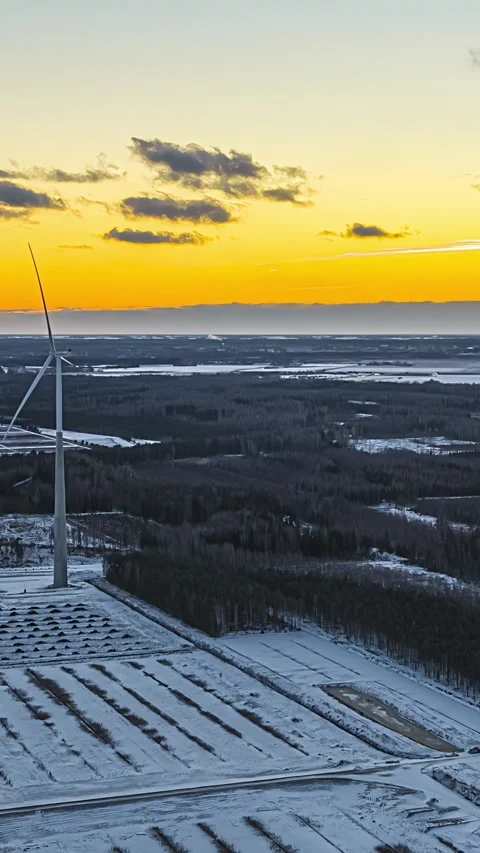 Wind Turbine Rotating Over Snowy Winter Landscape at Sunset Timelapse Stock Footage 342470102