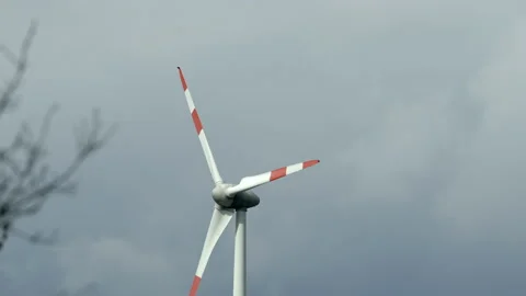 Wind turbine rotating in wind producing sustainable green energy Stock Footage 157551839