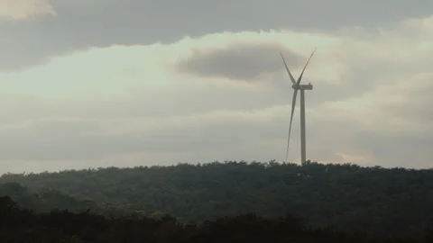 Wind Turbine in a Scenic Forest Landscape Stock Footage 282933783