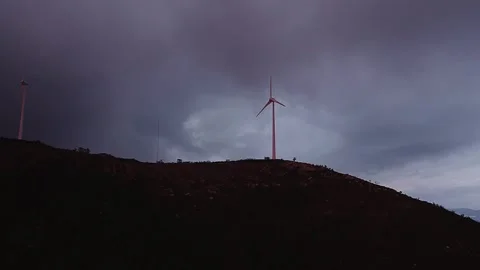Wind turbine on Serra da Boneca Penafiel Portugal ridge under dramatic sky Stockbeeldmateriaal 333306289