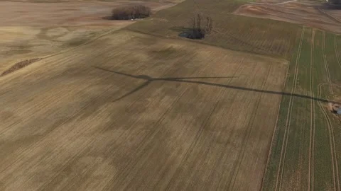 Wind Turbine Shadow Orbit Over Agricultural Field – Renewable Energy Aerial 4K 스톡 동영상 330860884