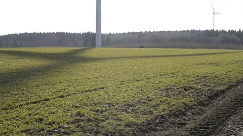 Wind turbine shadow rotating on green field. Sternberk Czech Republic Stock Footage 71484230